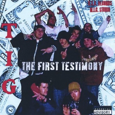 TIG – The First Testimony (CD) (2005) (FLAC + 320 kbps)