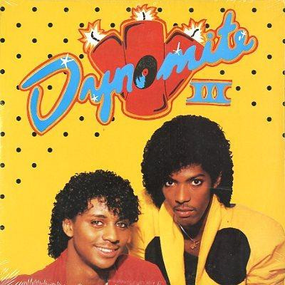 Dynomite III – We Need A Beat (VLS) (1985) (FLAC + 320 kbps)