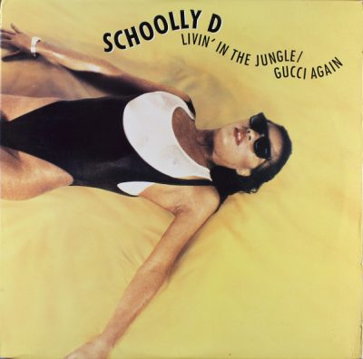 Schoolly D – Livin’ In The Jungle / Gucci Again (VLS) (1989) (FLAC + 320 kbps)